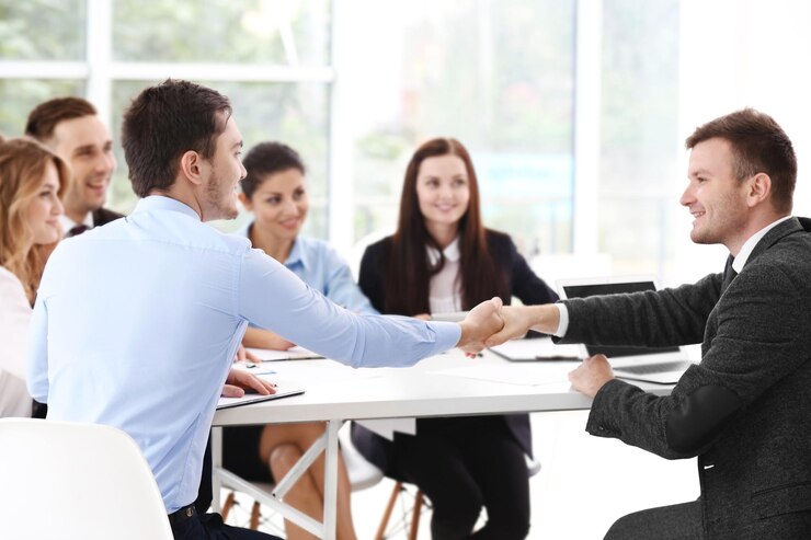Business people shaking hands at office